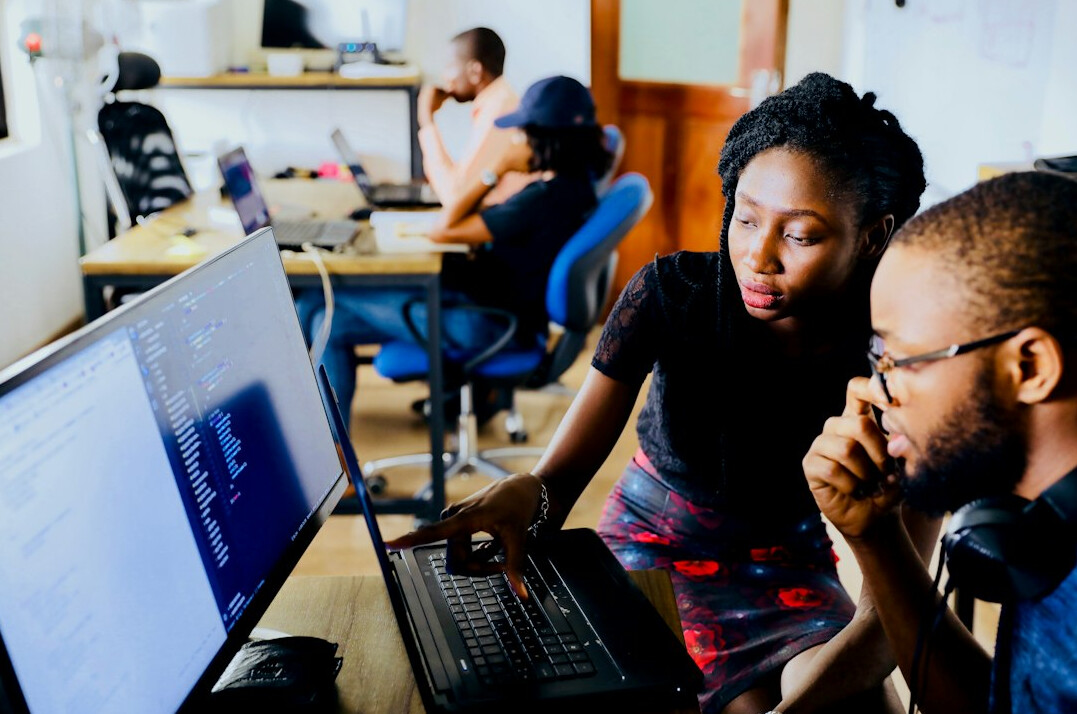 diverse team collaborating on code
