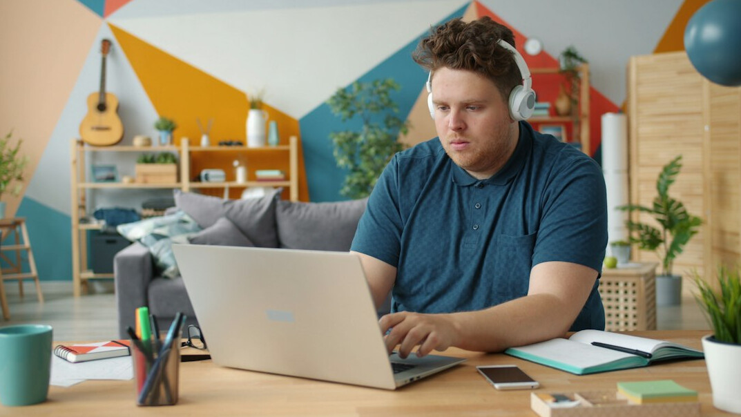 person working on laptop at home