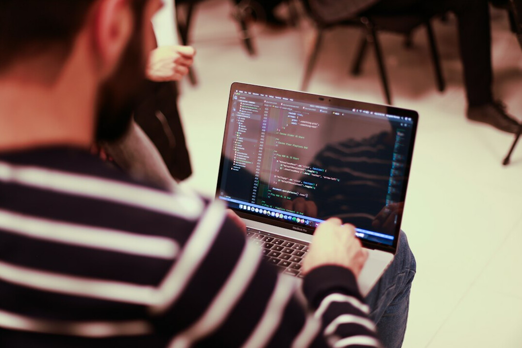 person learning to code on laptop