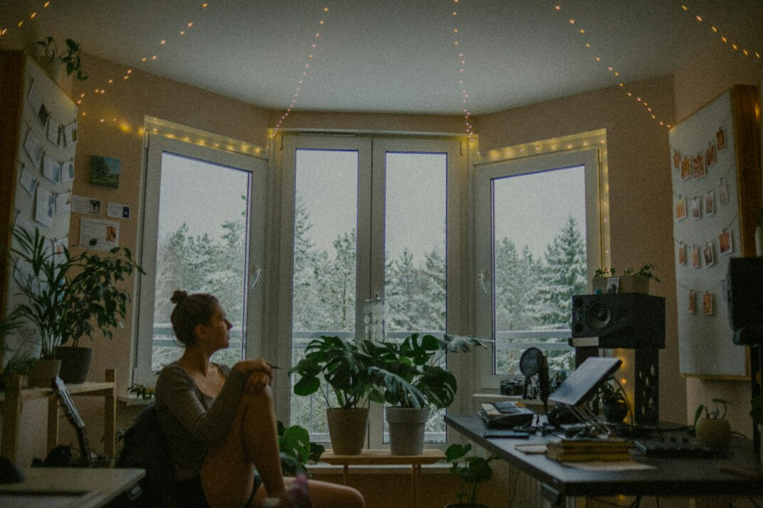 woman coding at home desk
