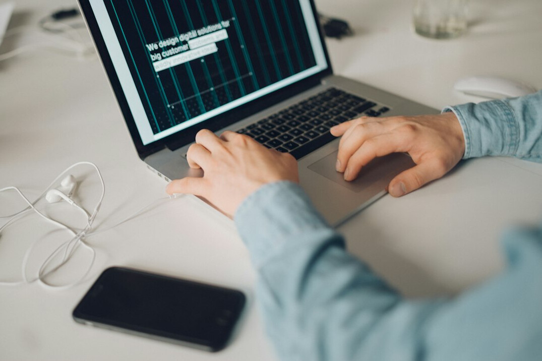 person learning to code on laptop